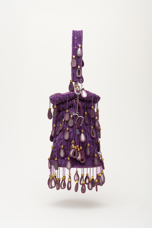 Purple Elio beaded bag with amethyst stone drops, gold accents, and shoulder strap from Martinas handcrafted collection