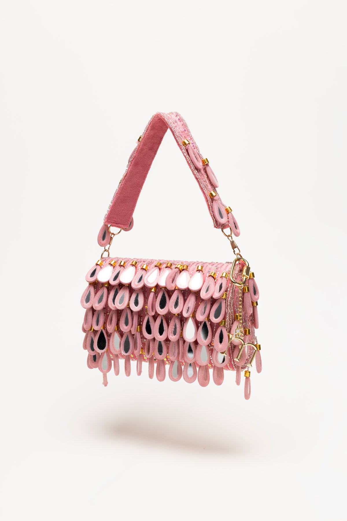 Handcrafted hot pink teardrop beaded bag with sequin base, fuchsia mirror-glass pendants, and glitter strap by Martinas