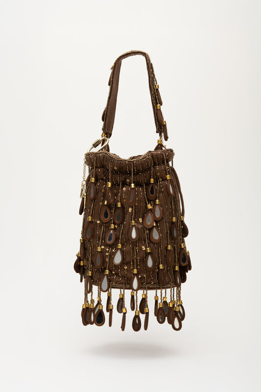 Brown Elio bucket bag with cascading teardrop mirror glass fringe, handcrafted statement piece with sequin detailing and shoulder strap