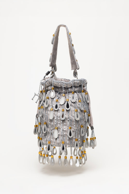 Silver Elio handcrafted bucket bag with cascading mirror teardrop fringe, sequin detailing and grey tones