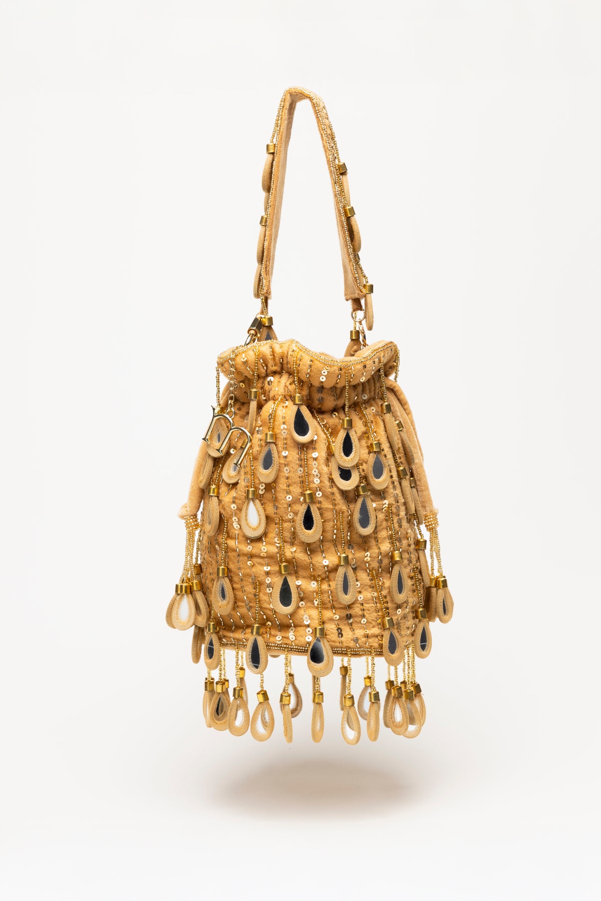 Gold Elio handcrafted bucket bag featuring warm gold mirror-glass drops, sequin detailing, and swinging pearl-glass fringe