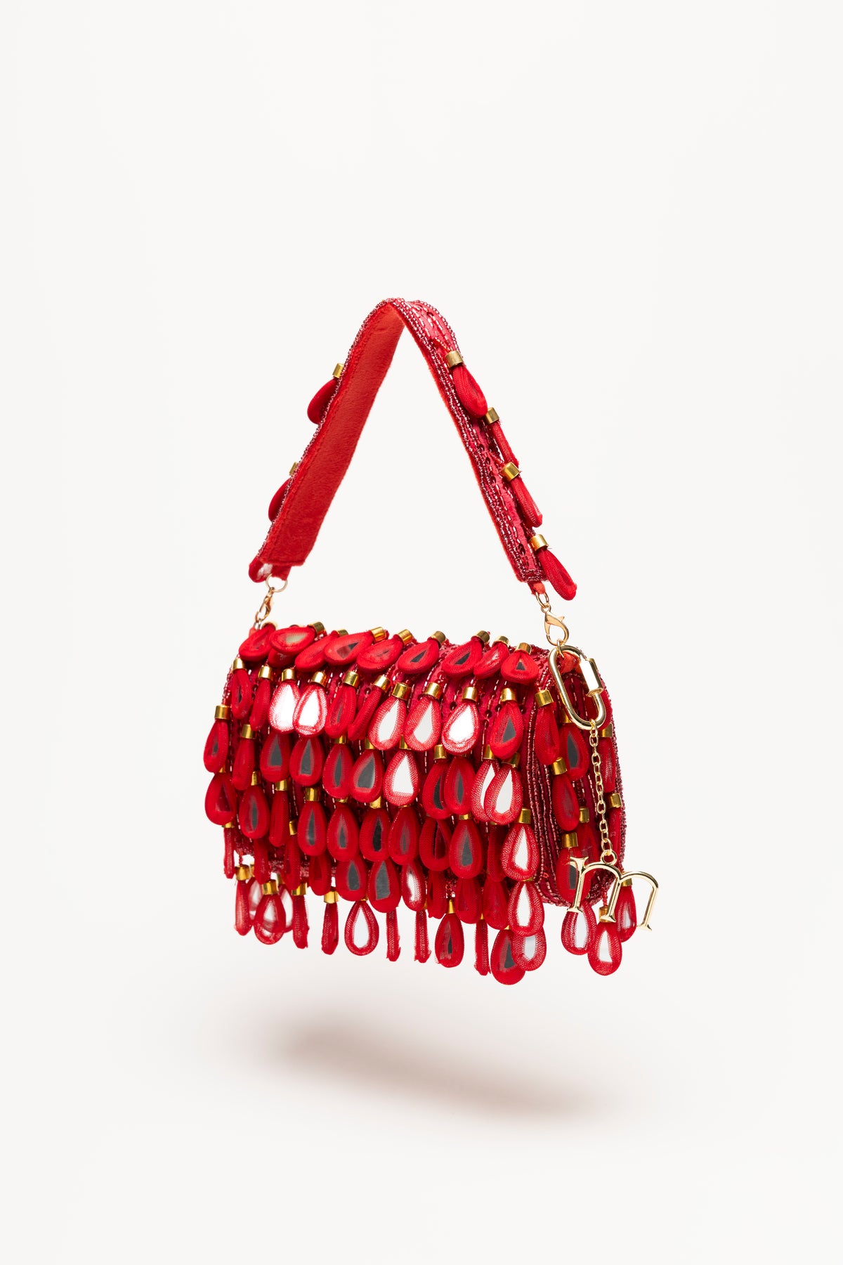 Red Martinas handcrafted statement bag with crimson sequin body and layered teardrop mirror pendants