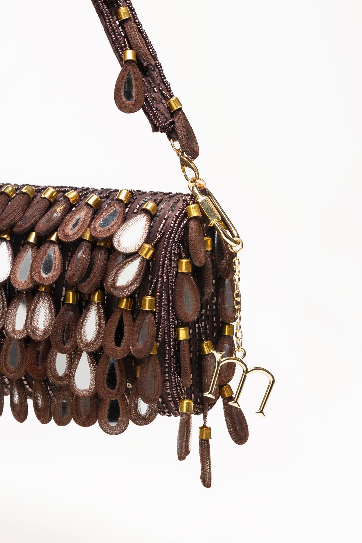 Espresso Martinas handcrafted beaded bag with layered teardrop pendants, mirror-glass centres, and gold hardware details