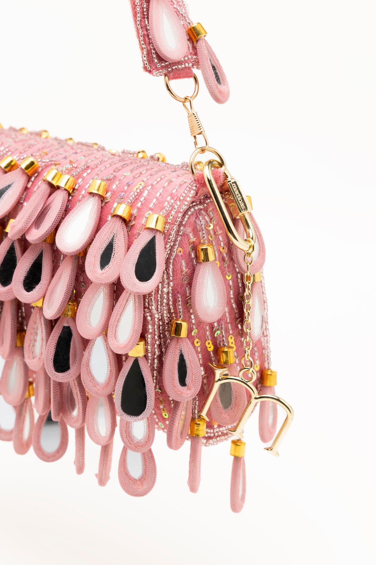 Handcrafted hot pink beaded bag with fuchsia teardrop pendants, sequin base, and glitter strap by Martinas