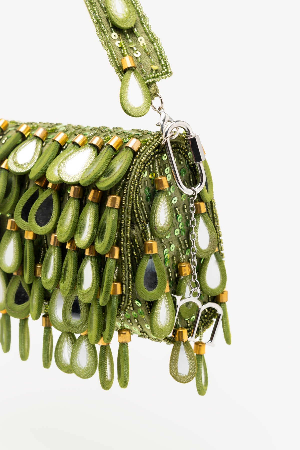 Handcrafted green beaded statement bag with mirror glass teardrop pendants, gold accents, and matching shoulder strap by Martinas