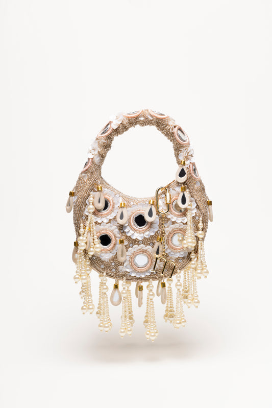 Beige Formentera hand-embroidered beaded bag with pearl cascades, mirrored details, and gold accents