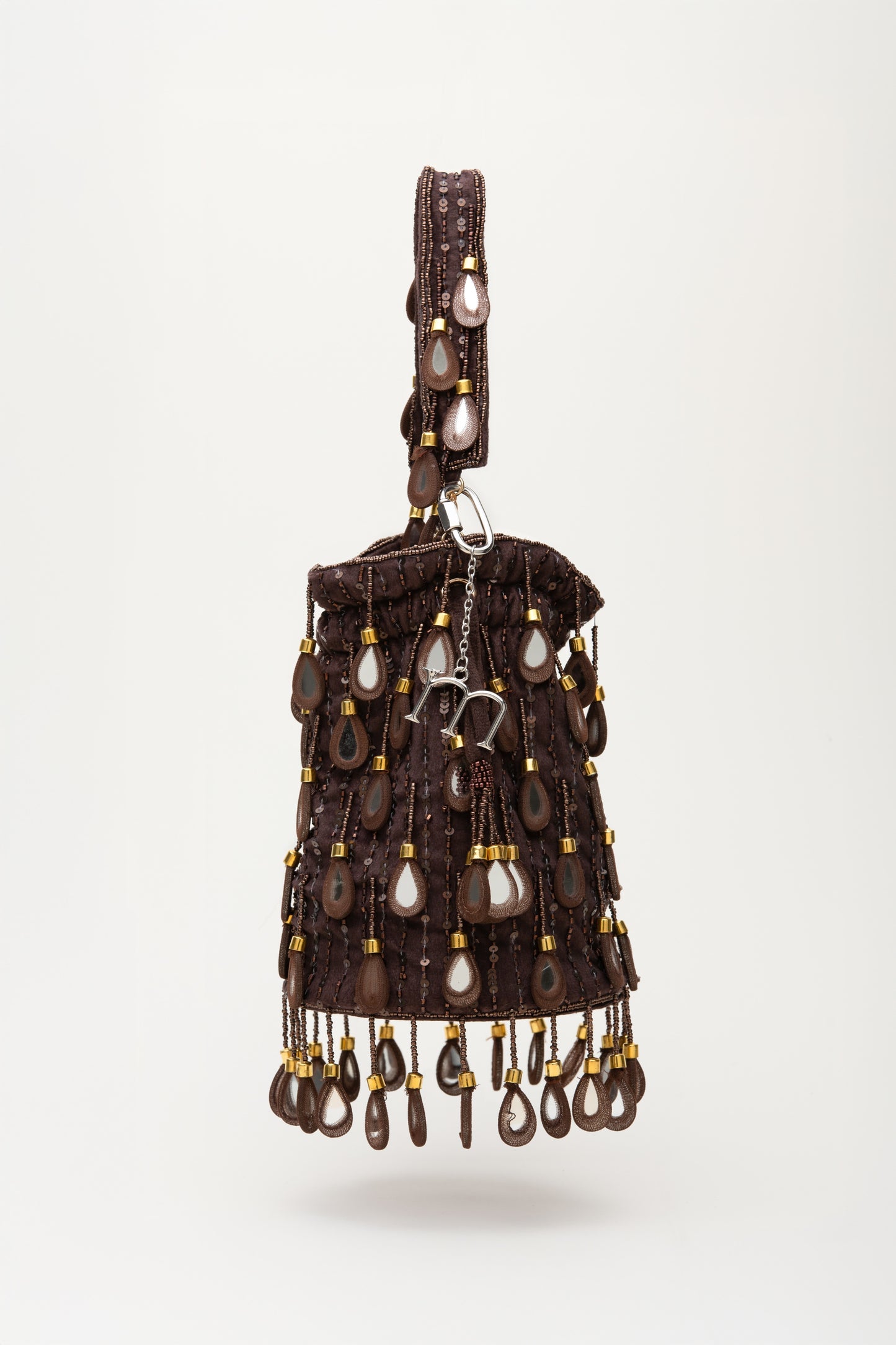 Brown Elio bucket bag with silver teardrop beads, sequins and cascading fringe detail, handcrafted statement accessory