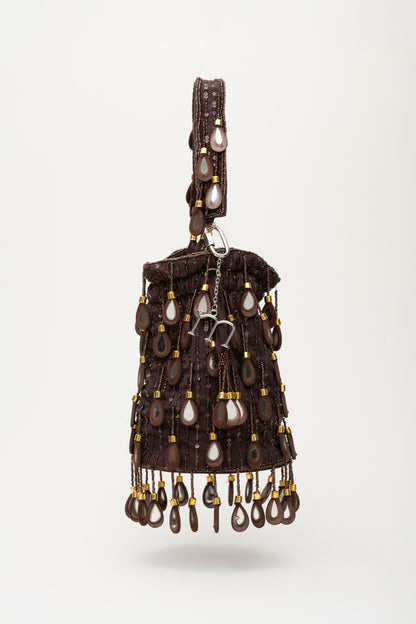 Brown Elio bucket bag with silver teardrop beads, sequins and cascading fringe detail, handcrafted statement accessory